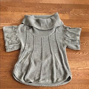 Grey small BCBG Max Azria sweater with flattering shape and front pockets.